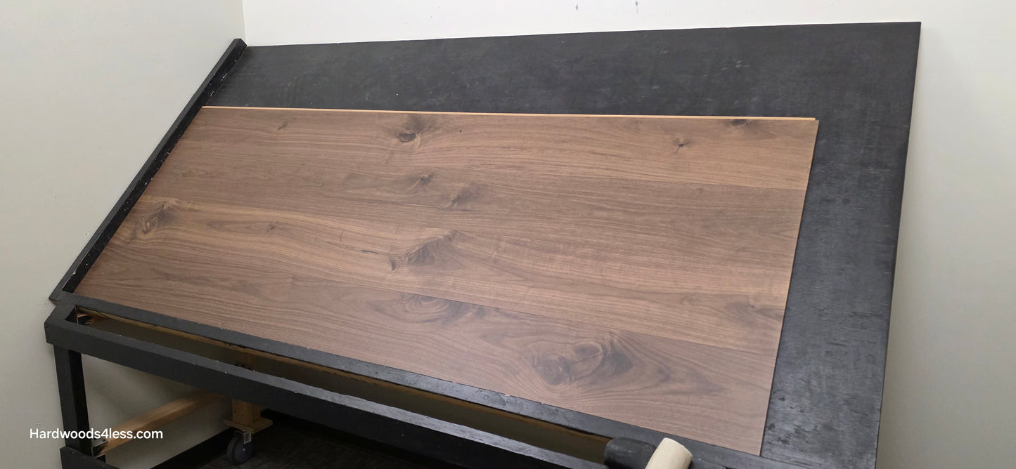 8.11" x 7/16" Modernized Engineered Walnut Calatrava Hardened Hardwood Flooring. Shown on a black shooting table. Shot from wide right.