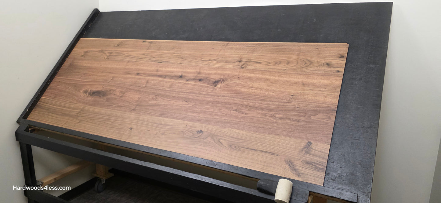 8.11" x 7/16" Modernized Engineered Walnut Wright Hardened Hardwood Flooring. Shown on a black shooting table. Shot from wide right.