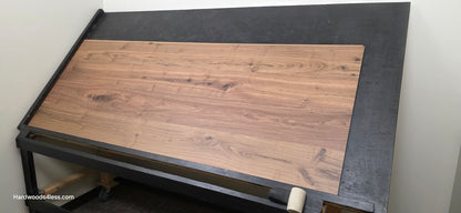 8.11" x 7/16" Modernized Engineered Walnut Wright Hardened Hardwood Flooring. Shown on a black shooting table. Shot from wide right.