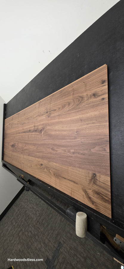 8.11" x 7/16" Modernized Engineered Walnut Wright Hardened Hardwood Flooring. Shown on a black shooting table. Shot from steep right.