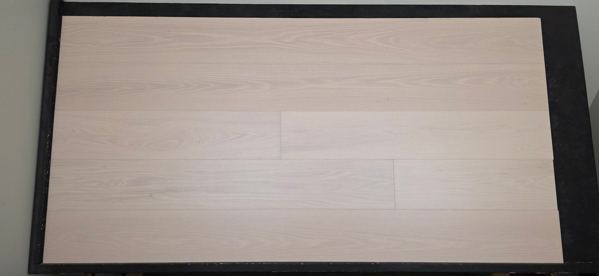 Engineered European Oak Antenne Hardwood Flooring wide front shot on a black table