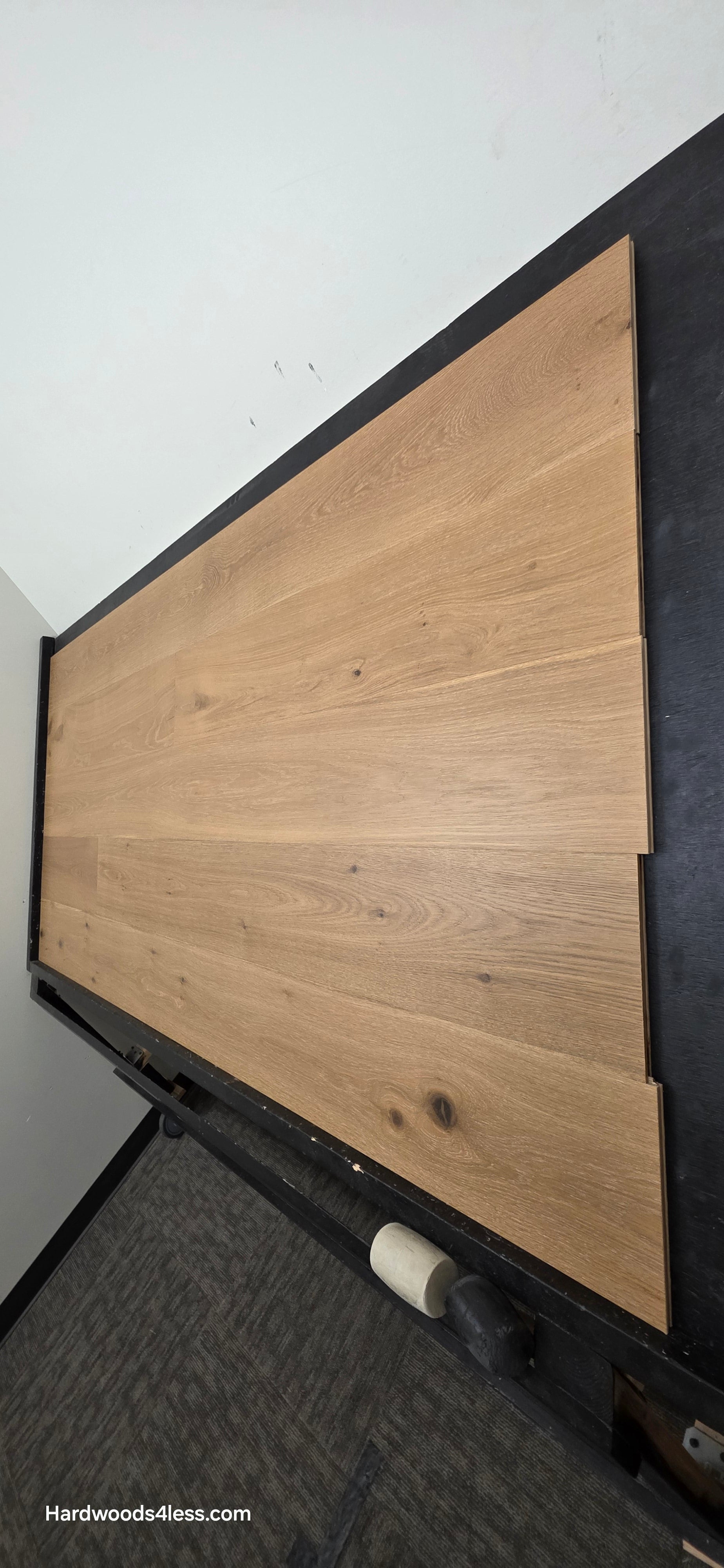 8.66" x 5/8" Engineered European Oak Pacific Grove Hardwood Flooring. Shown on a black shooting table. Shot from steep right.