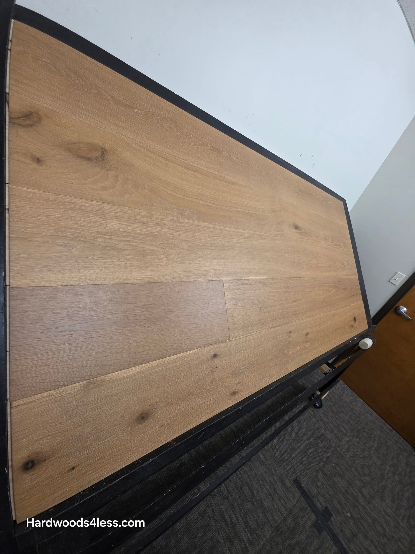 8.66" x 5/8" Engineered European Oak Pacific Grove Hardwood Flooring. Shown on a black shooting table. Shot from steep left.