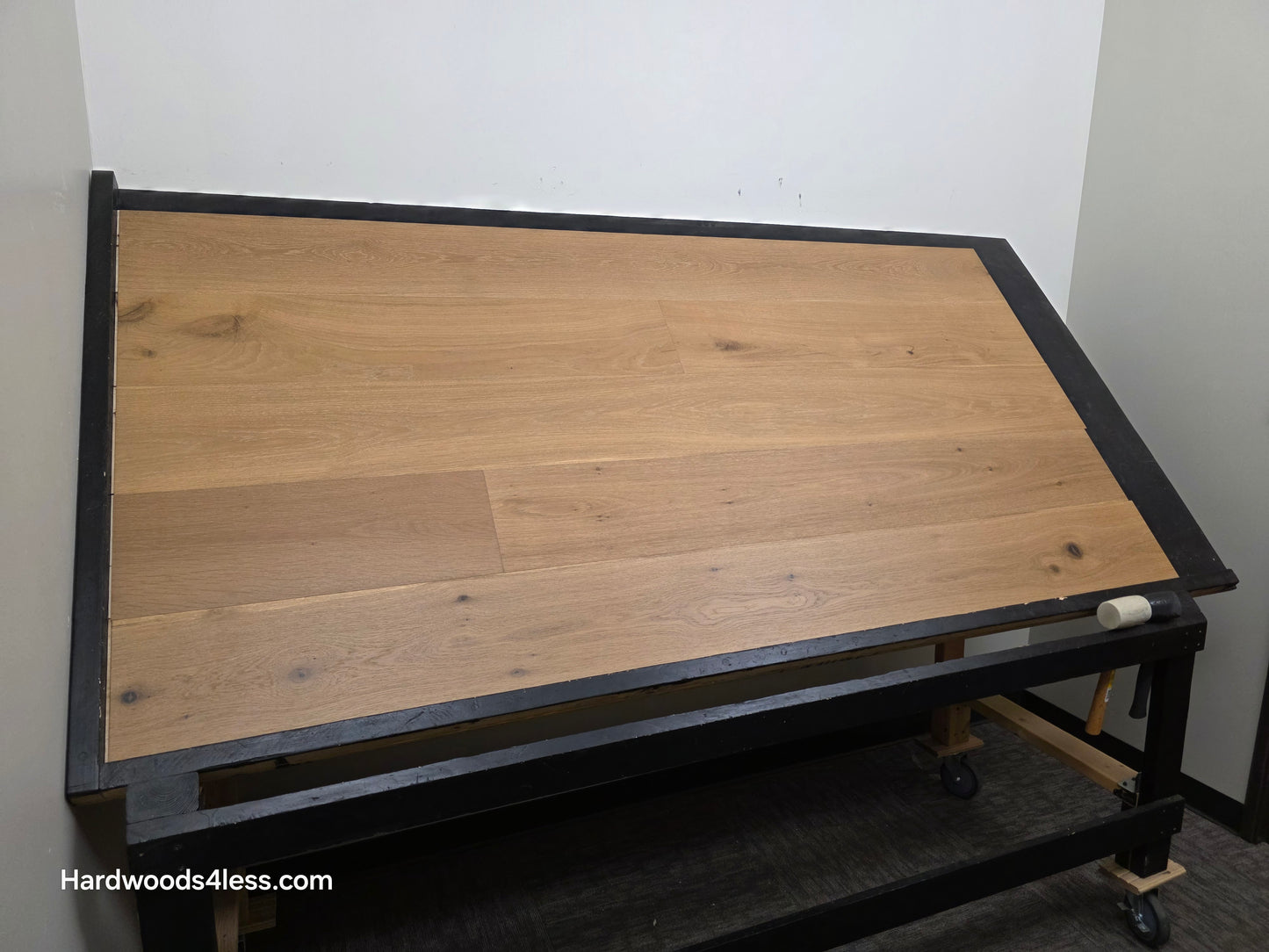 8.66" x 5/8" Engineered European Oak Pacific Grove Hardwood Flooring. Shown on a black shooting table. Shot from wide right.