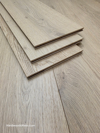 8.66" x 5/8" Engineered European Oak Pismo Stain Hardwood Flooring. Shown as 3 tiles stacked on the floor. Shot very close up. 