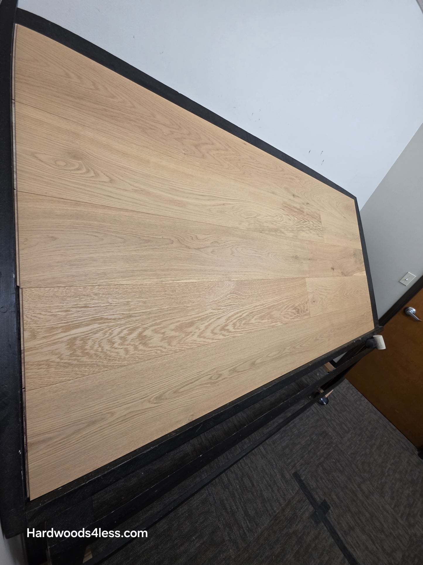 8.66" x 5/8" Engineered European Oak Pismo Stain Hardwood Flooring. Shown on a black shooting table. Shot from steep left. 