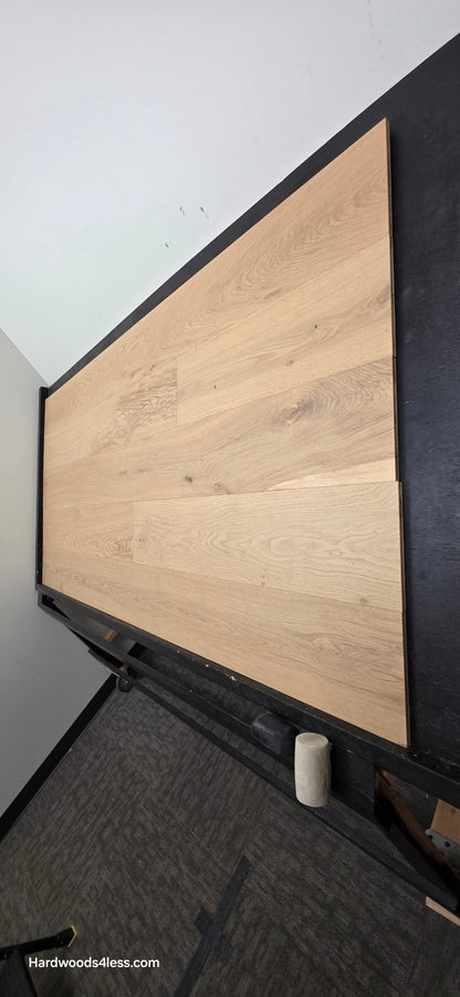 8.66" x 5/8" Engineered European Oak Pismo Stain Hardwood Flooring. Shown on a black shooting table. Shot from steep left. 