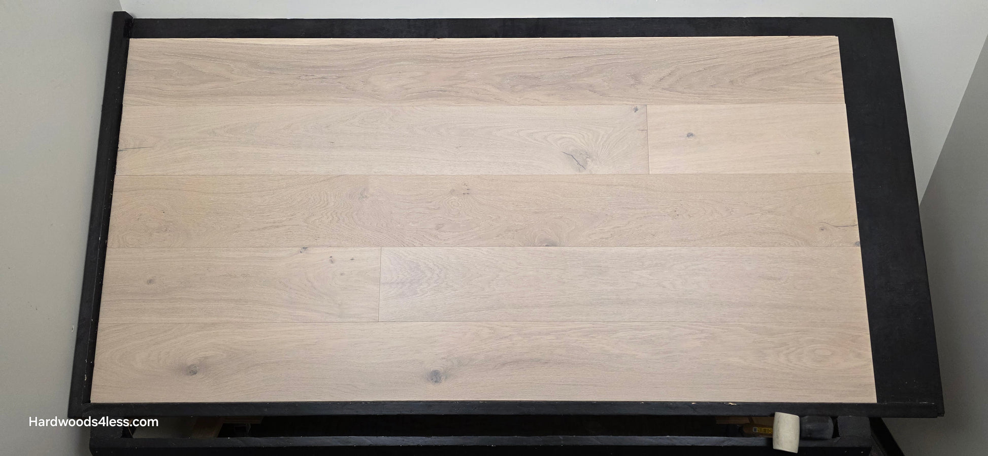 8.66" x 5/8" Engineered European Oak Solana Stain Hardwood Flooring. Shown on a black shooting table. Shot from center.
