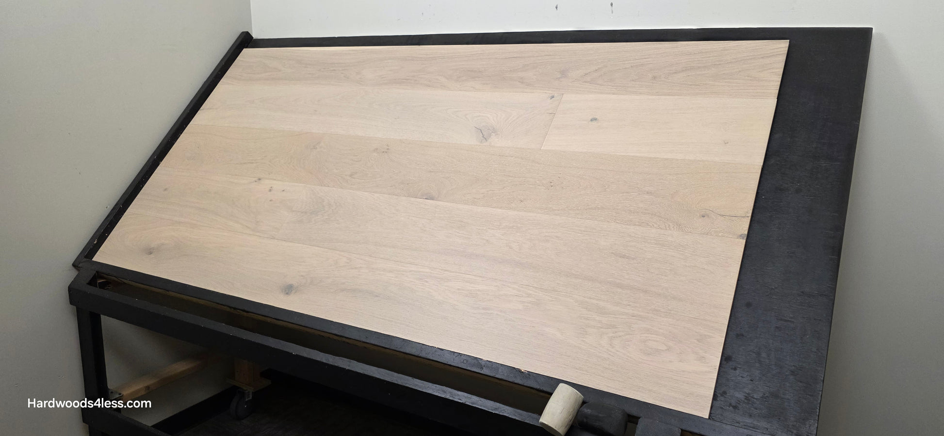 8.66" x 5/8" Engineered European Oak Solana Stain Hardwood Flooring. Shown on a black shooting table. Shot from wide right.