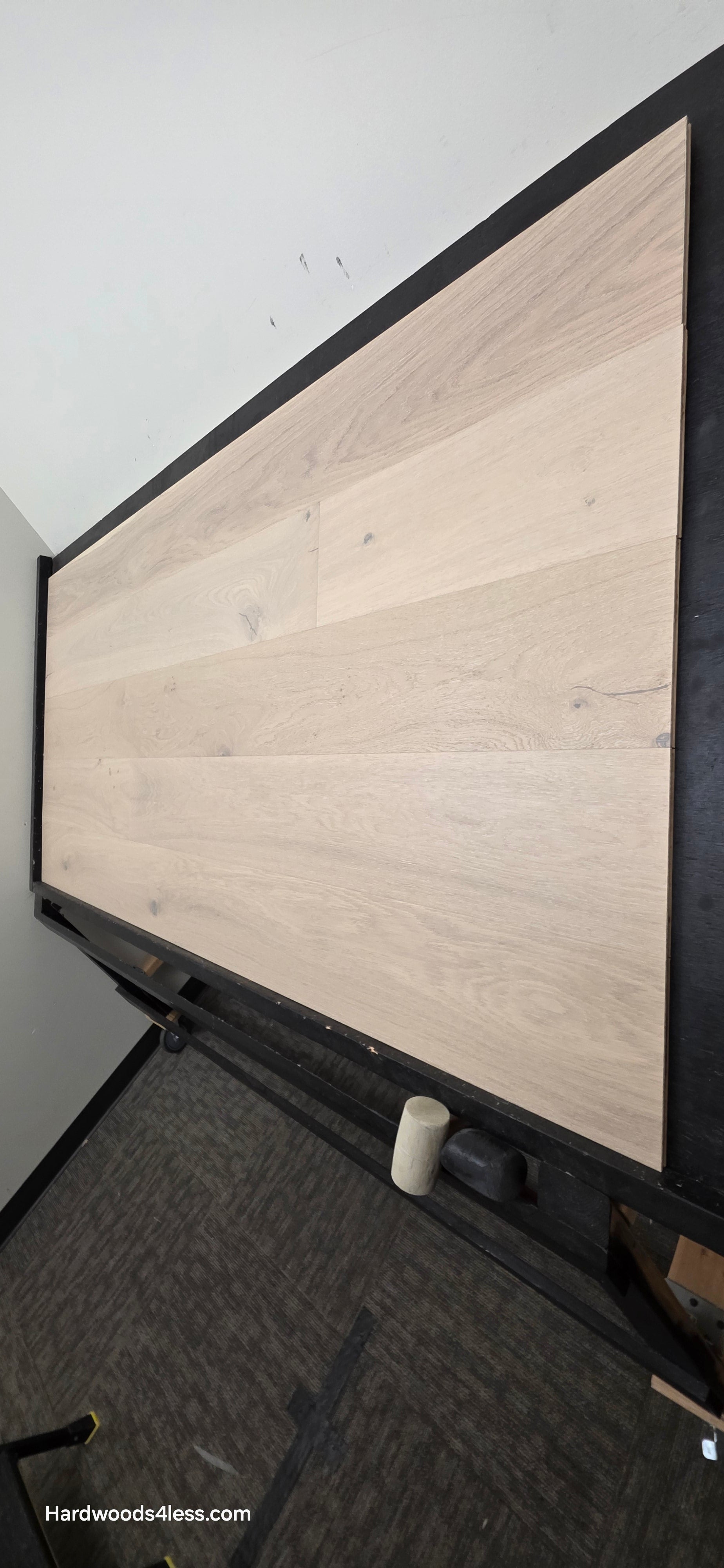8.66" x 5/8" Engineered European Oak Solana Stain Hardwood Flooring. Shown on a black shooting table. Shot from steep right. 