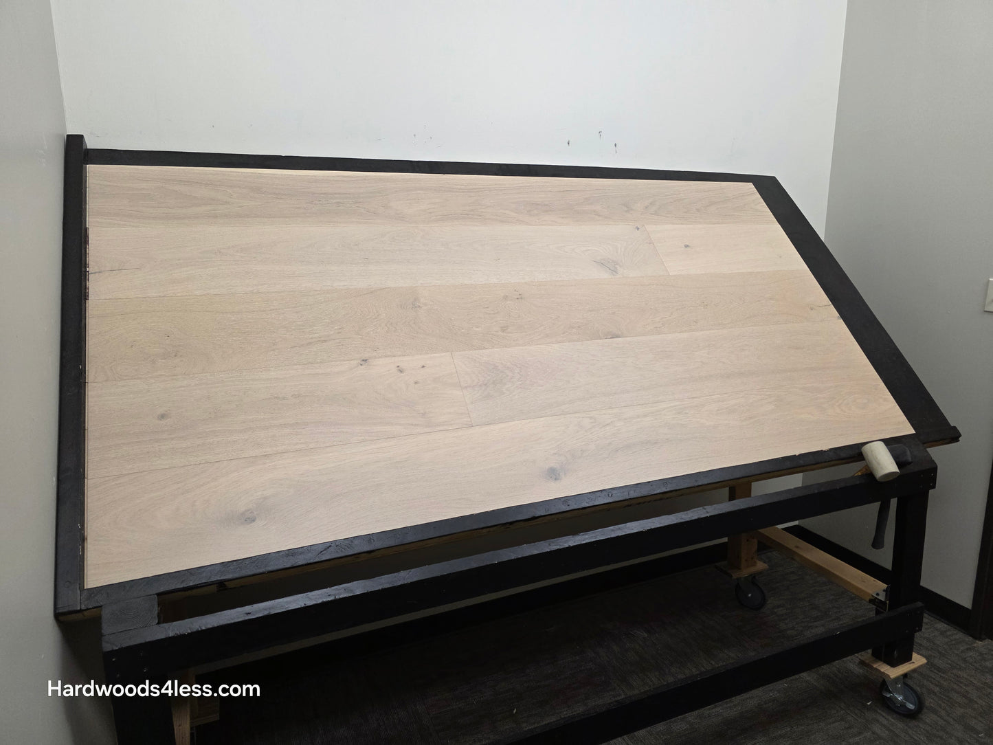 8.66" x 5/8" Engineered European Oak Solana Stain Hardwood Flooring. Shown on a black shooting table. Shot from wide left.