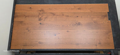 8 1/4" x 9/16" Engineered European Oak Corinth Hardwood Flooring. Shown on a black shooting rack. shot at center.