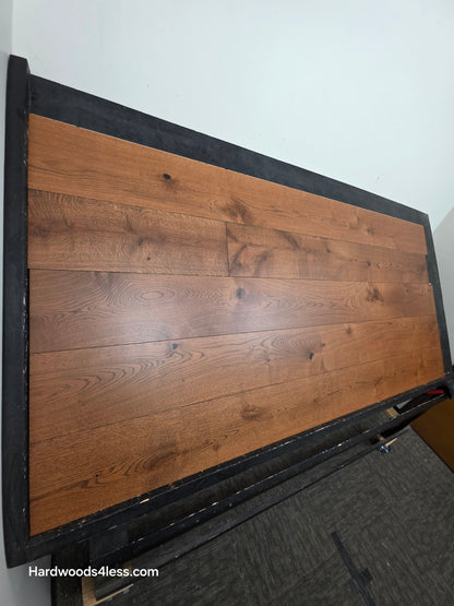 8 1/4" x 9/16" Engineered European Oak Corinth Hardwood Flooring. Shown on a black shooting rack. Shot wide left.