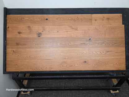 8 1/4" x 9/16" Engineered European Oak Helios Hardwood Flooring. Shown on a black shooting table. center shot. 