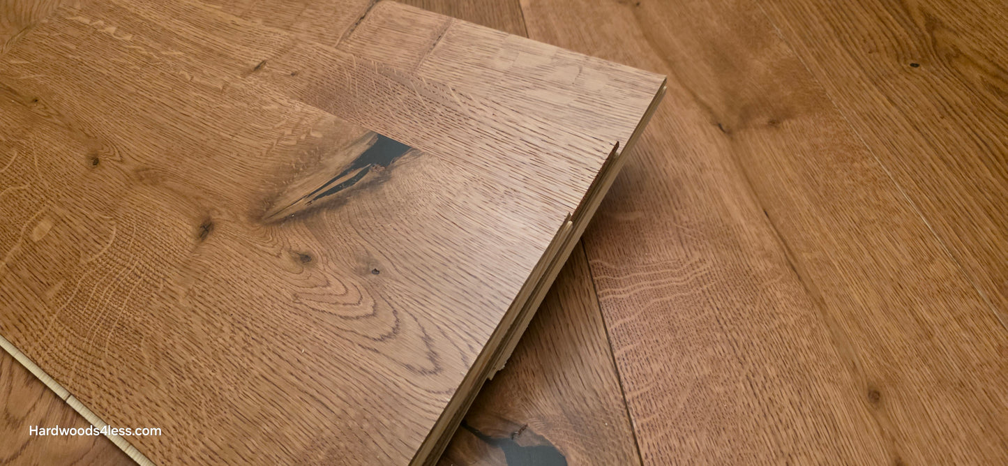 8 1/4" x 9/16" Engineered European Oak Helios Hardwood Flooring. Three tiles stacked on the floor. steep left angle. 