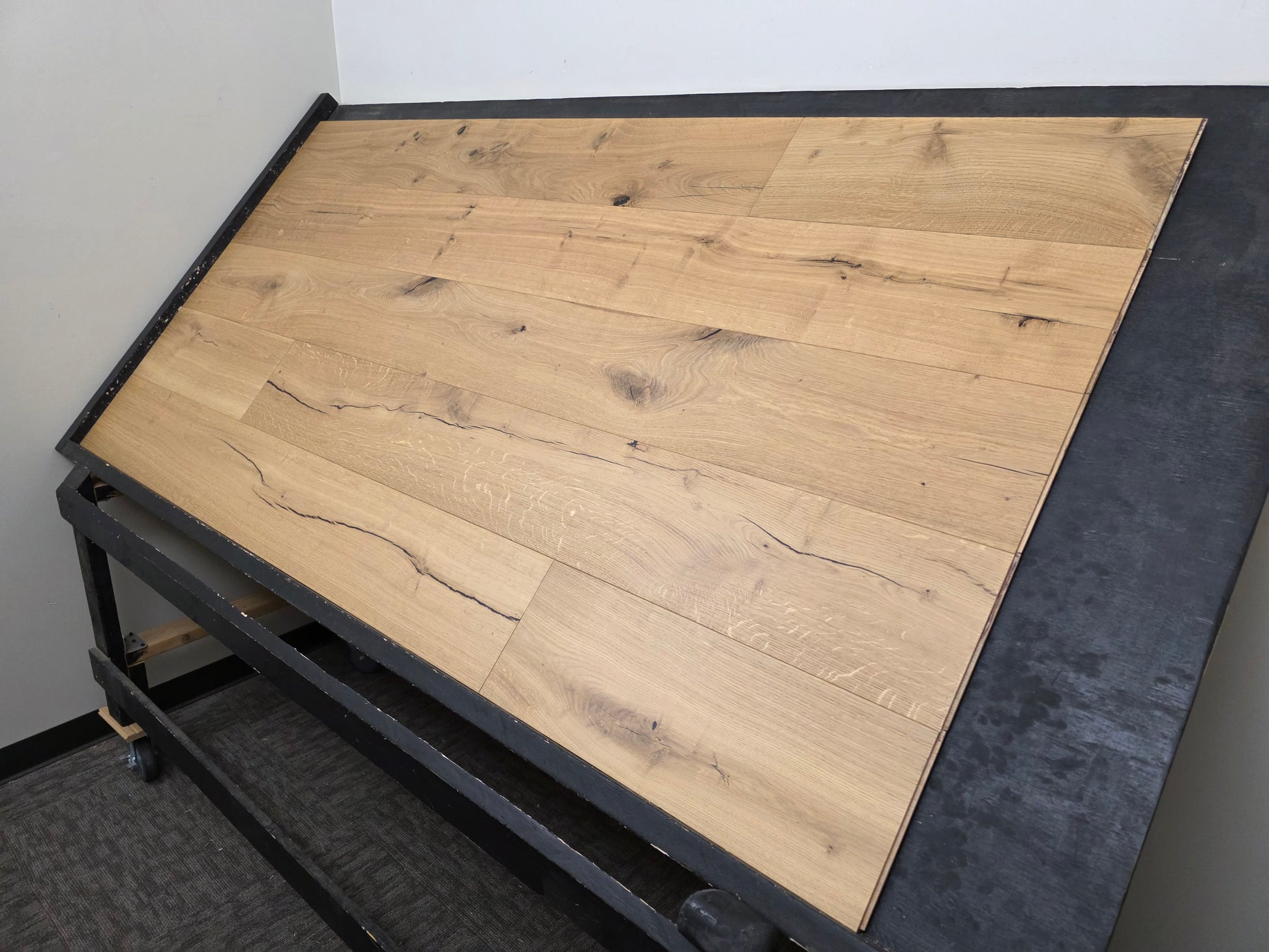 European White Oak hardwood flooring on a black racking table wide shot right side