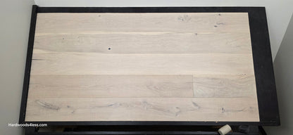8 5/8" x 5/8" Engineered European Oak Granacci Hardwood Flooring. Shown on a black shooting table. Shot from center.