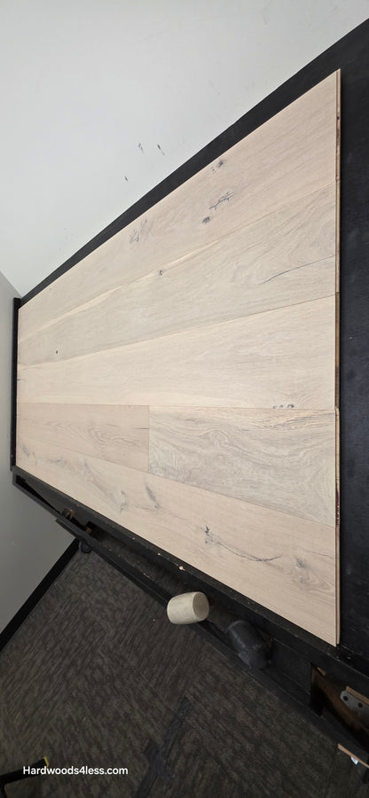 8 5/8" x 5/8" Engineered European Oak Granacci Hardwood Flooring. Shown on a black shooting table. Shot from steep right.