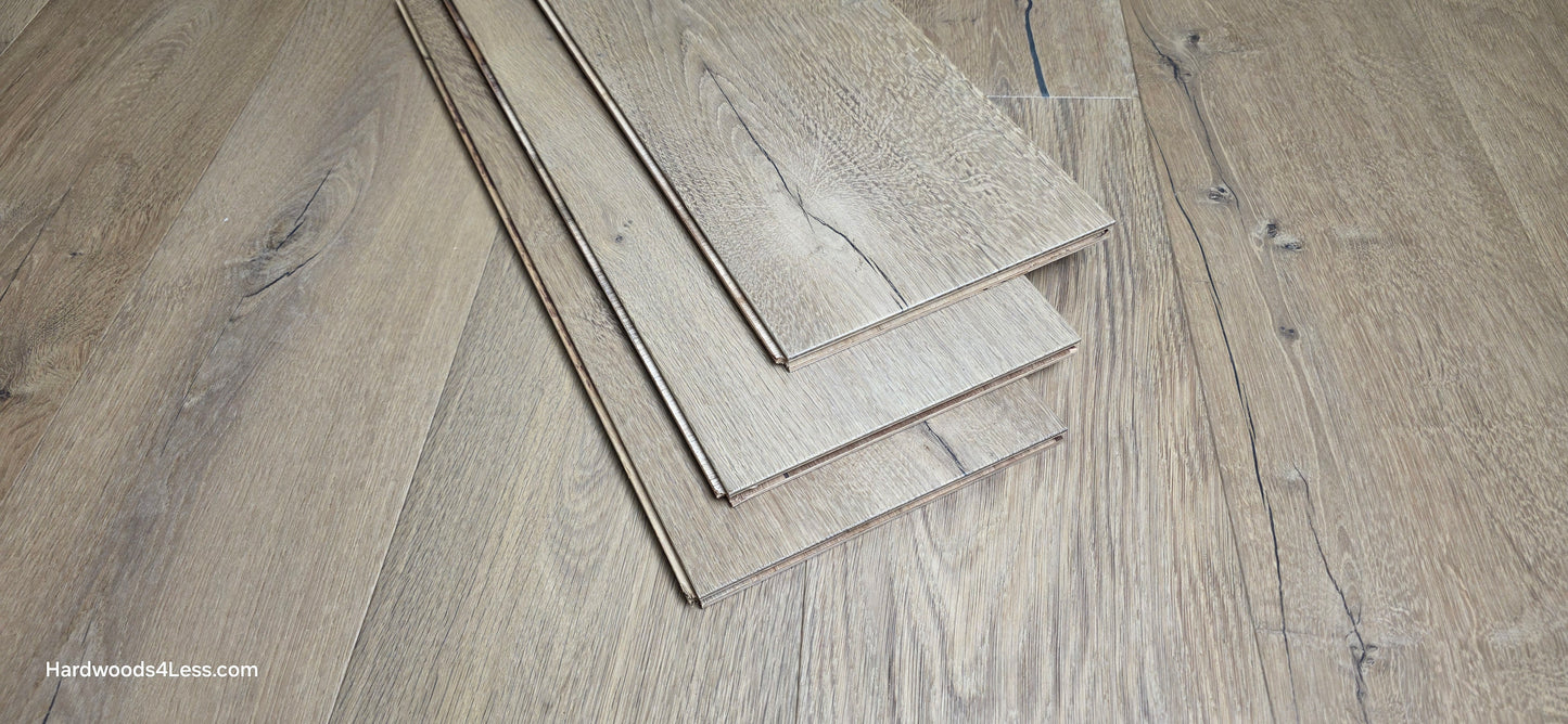 8 5/8" x 5/8" Engineered European Oak Highball Hardwood Flooring. Shown at center are 3 planks of the flooring. The planks are resting on top of the European oak flooring.