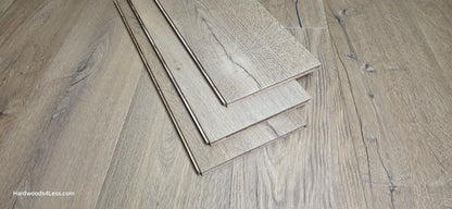 8 5/8" x 5/8" Engineered European Oak Highball Hardwood Flooring. Shown at center are 3 planks of the flooring. The planks are resting on top of the European oak flooring.