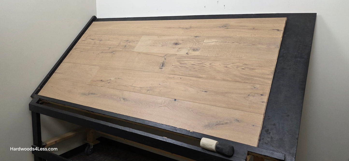 8 5/8" x 5/8" Engineered European Oak Highball Hardwood Flooring. Shown on a black shooting table. Shot from wide right.