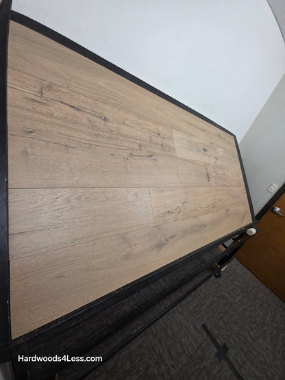 8 5/8" x 5/8" Engineered European Oak Highball Hardwood Flooring. Shown on a black shooting table. Shot from steep left. 