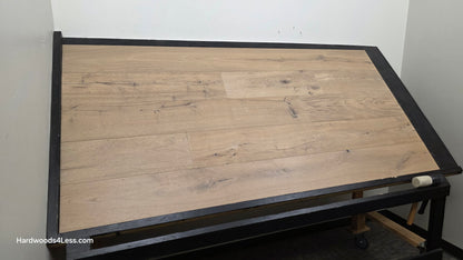 8 5/8" x 5/8" Engineered European Oak Highball Hardwood Flooring. Shown on a black shooting table. Shot from wide left. 