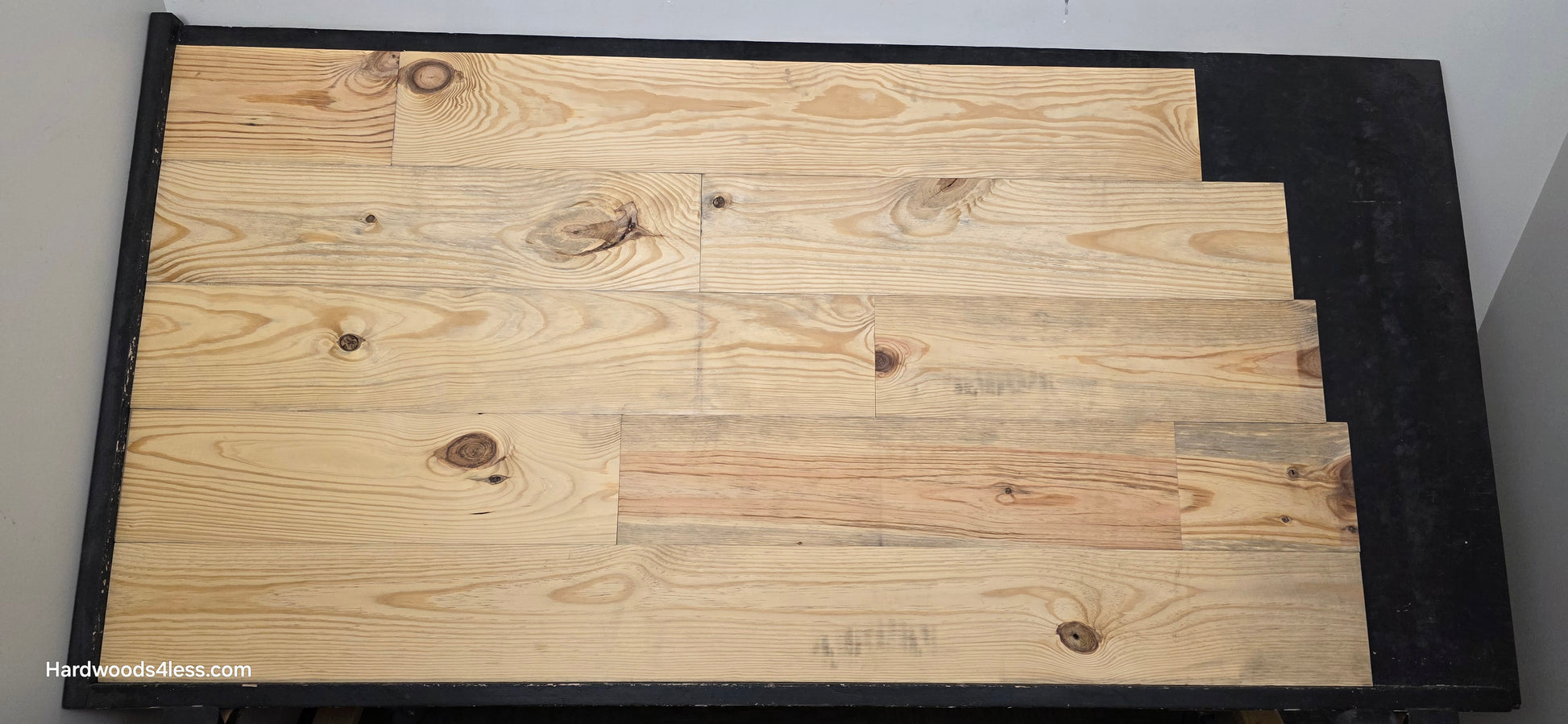 8 7/8" x 3/4" Unfinished Southern Yellow Pine Solid Flooring Shown on a black shooting table