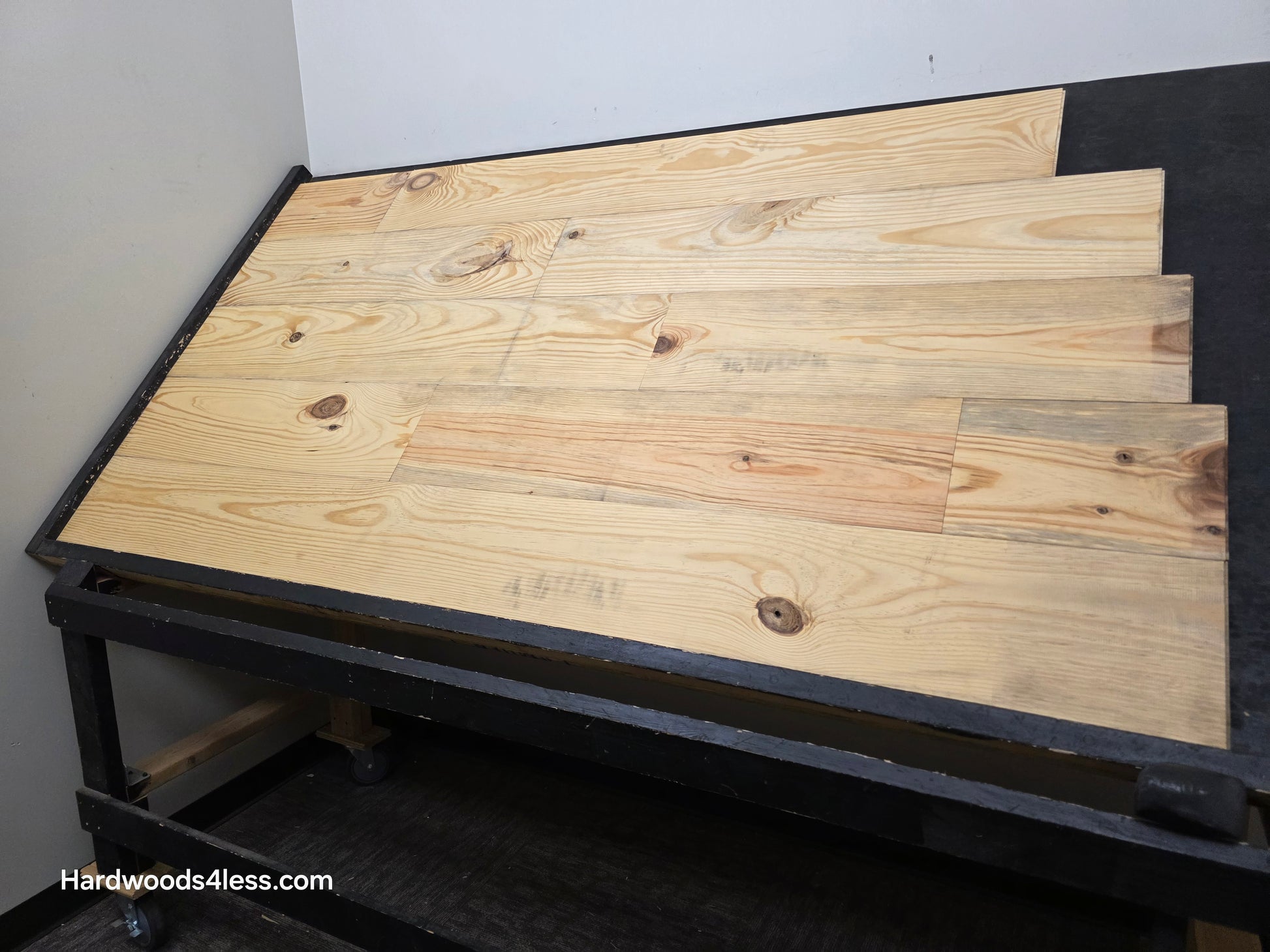8 7/8" x 3/4" Unfinished Southern Yellow Pine Solid Flooring shown on a shooting table.
