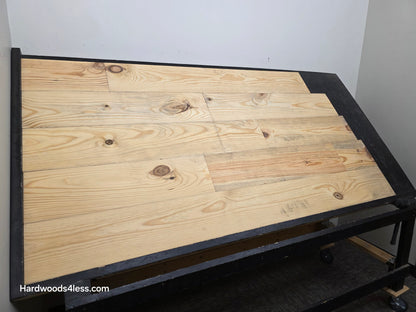 8 7/8" x 3/4" Unfinished Southern Yellow Pine Solid Flooring shown on a shooting table.