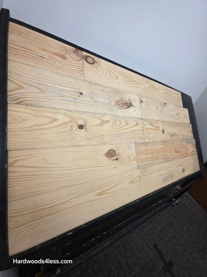 8 7/8" x 3/4" Unfinished Southern Yellow Pine Solid Flooring shown on a shooting table.