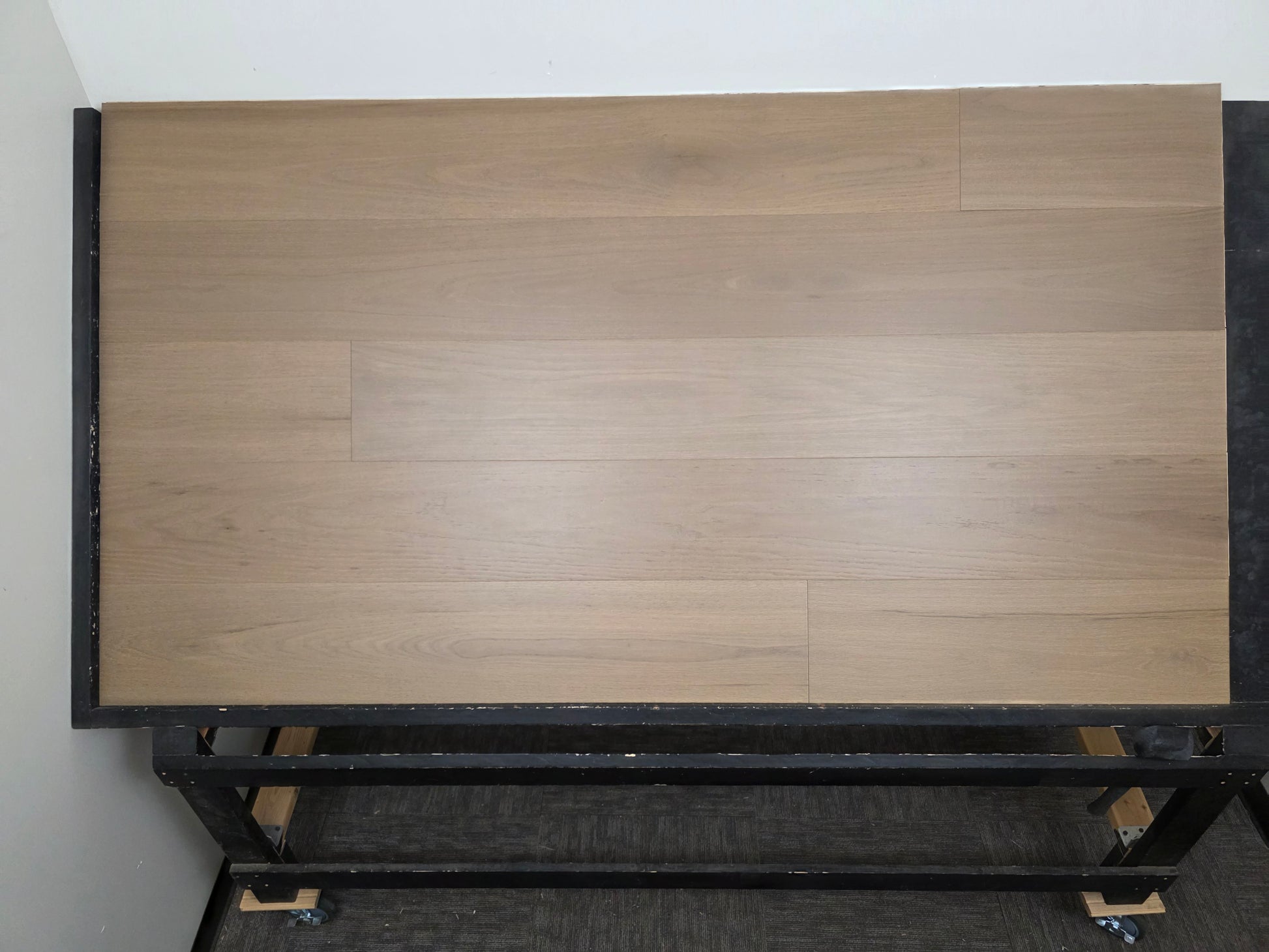 Engineered Red Oak Umbriel Hardwood Flooring wide on a black shooting rack head on shot