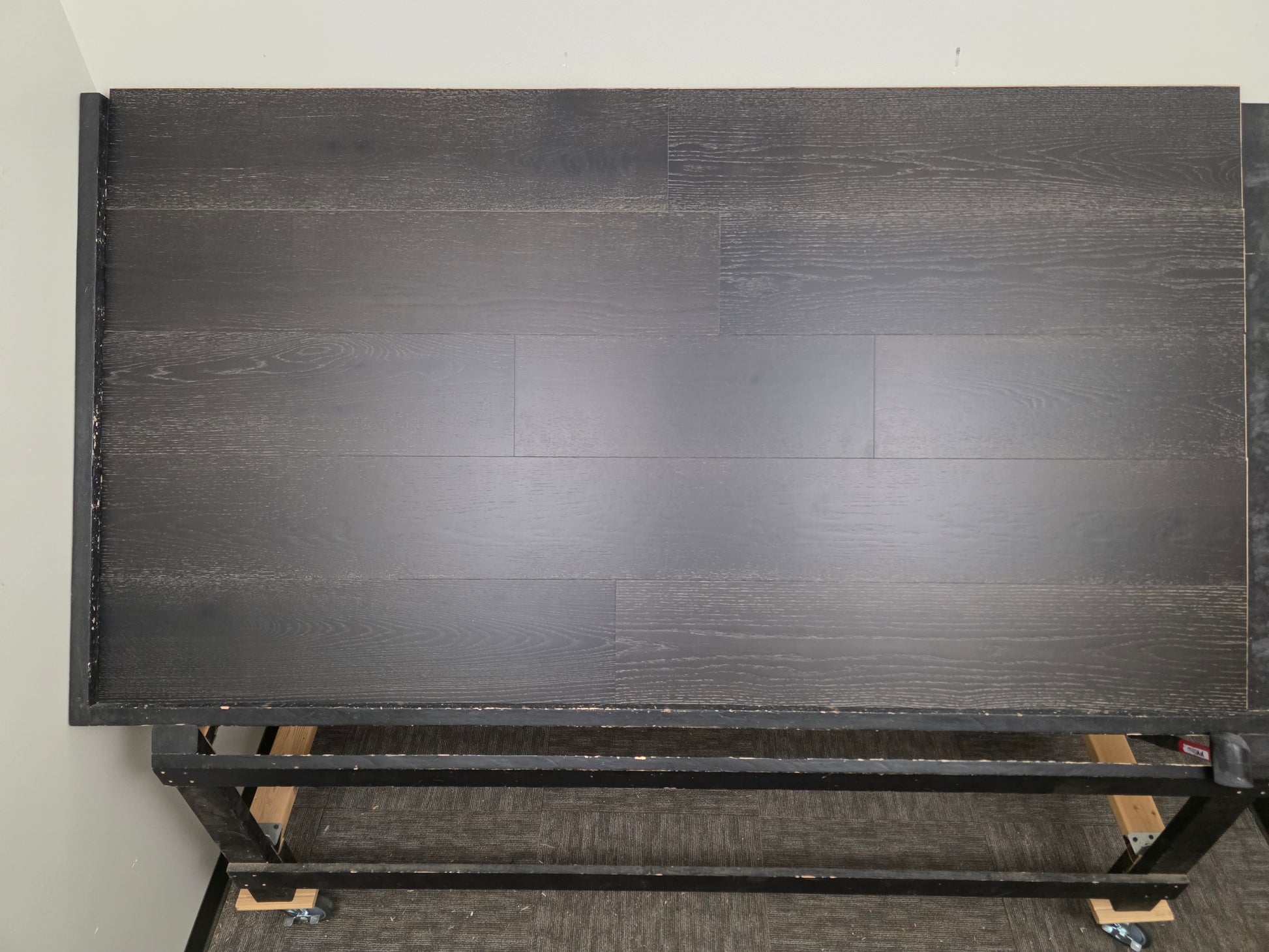 9 1/2" x 5/8" Engineered Red Oak Uriel Hardwood Flooring on a black shooting rack head on.