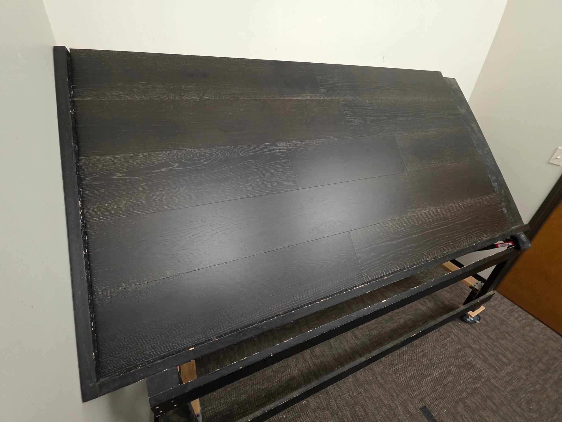 9 1/2" x 5/8" Engineered Red Oak Uriel Hardwood Flooring on a black shooting table left side shot 