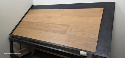 9 1/2" x 3/4" Engineered European Oak Albion Hardwood Flooring. Show on a black shooting table. Shot from wide right.