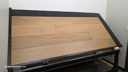 9 1/2" x 3/4" Engineered European Oak Albion Hardwood Flooring. Show on a black shooting table. Shot from wide left.