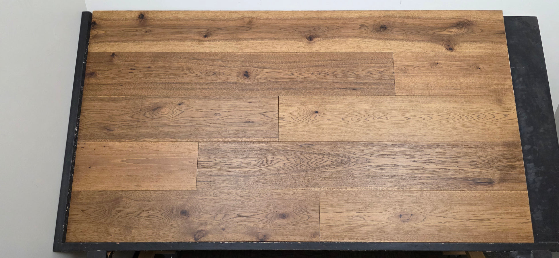 9 1/2" x 5/8" Engineered Hickory Andrews Hardwood Flooring on a black shooting table head on 