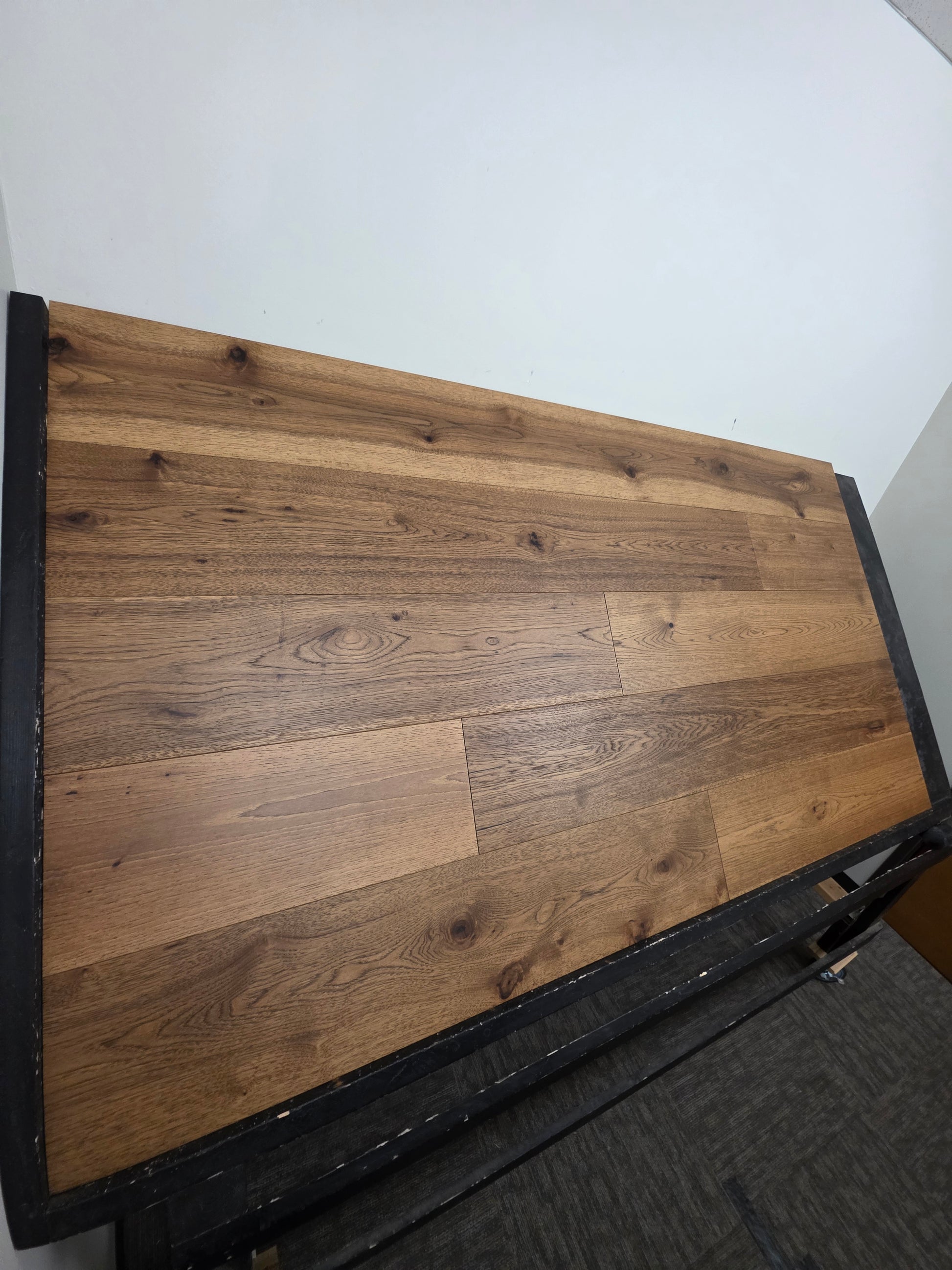 9 1/2" x 5/8" Engineered Hickory Andrews Hardwood Flooring on a black shooting table steep left angle shot