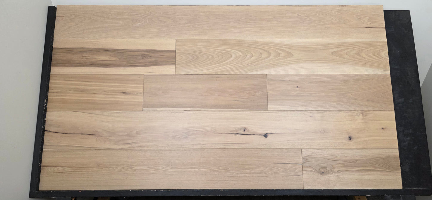 9 1/2" x 5/8" Engineered Hickory Chapman Hardwood Flooring on a black shooting table front on shot