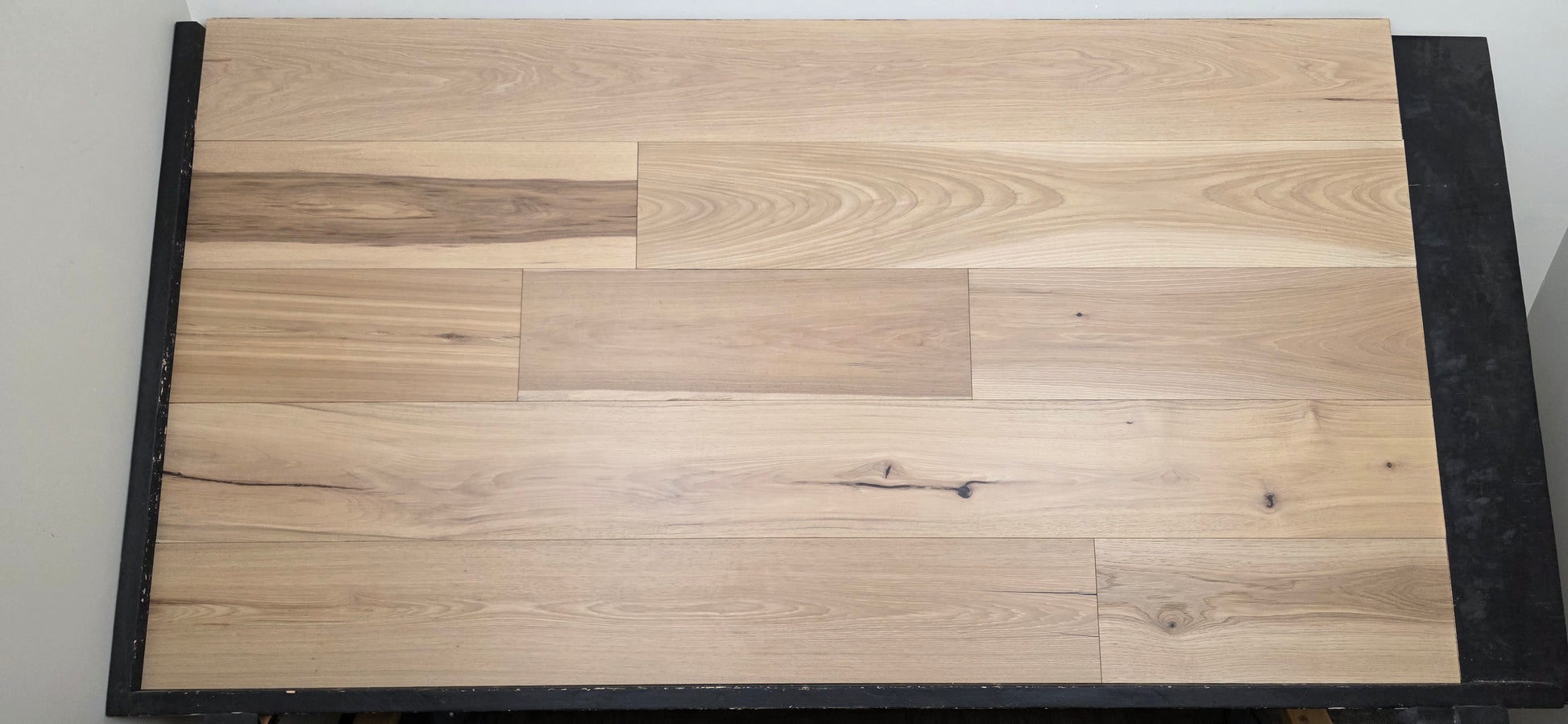 9 1/2" x 5/8" Engineered Hickory Chapman Hardwood Flooring on a black shooting table front on shot