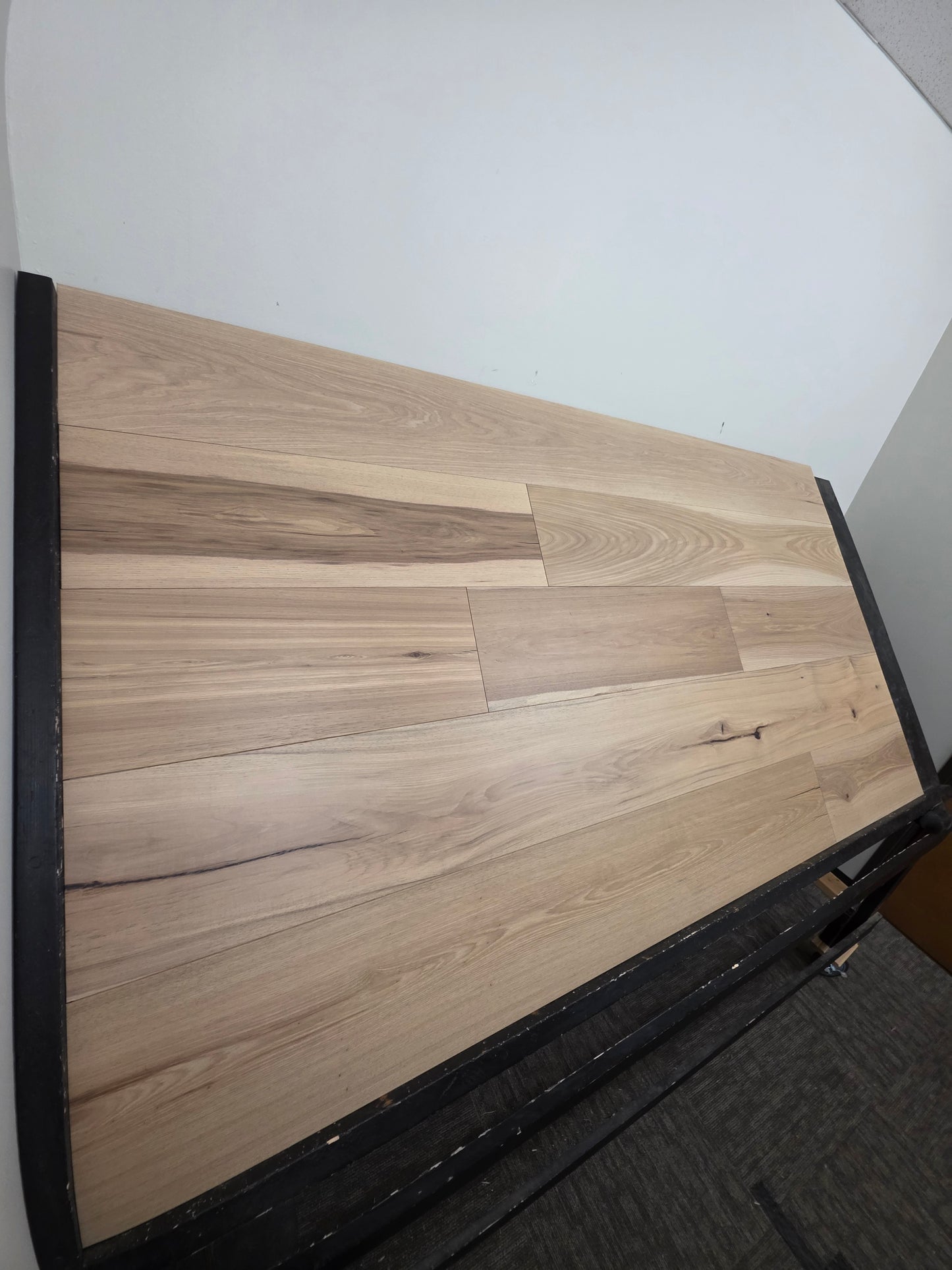 9 1/2" x 5/8" Engineered Hickory Chapman Hardwood Flooring on a black shooting rack left hand shot 