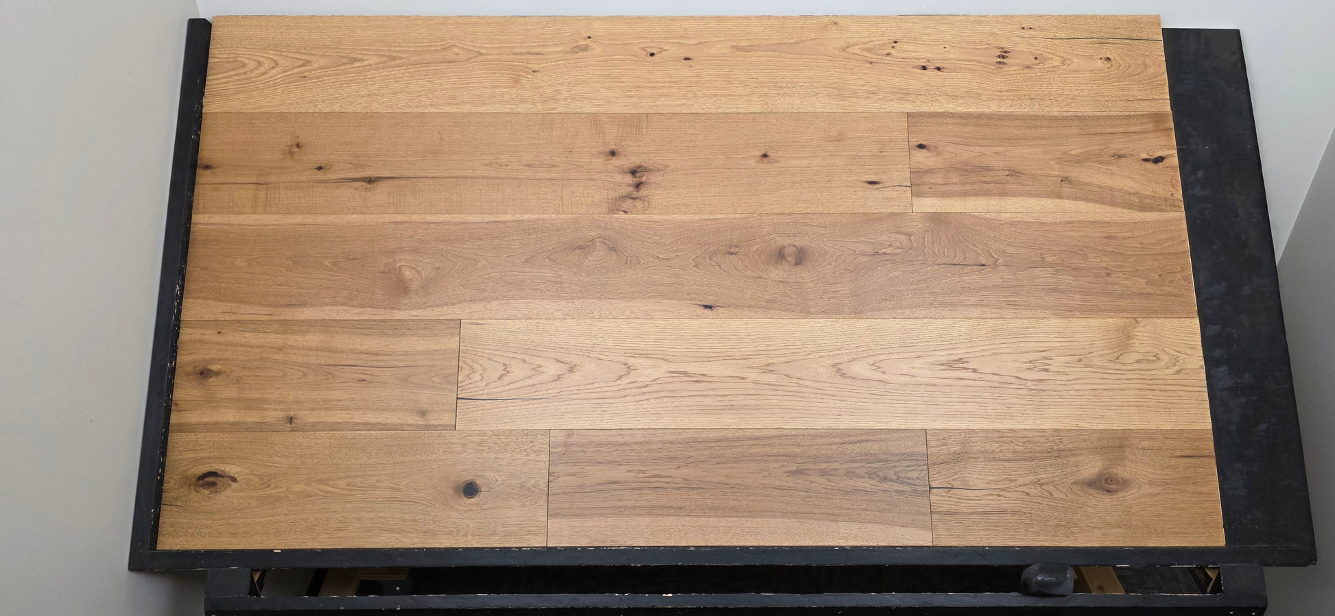 9 1/2" x 5/8" Engineered Hickory Collins Hardwood Flooring on a black shooting table wide shot head on 