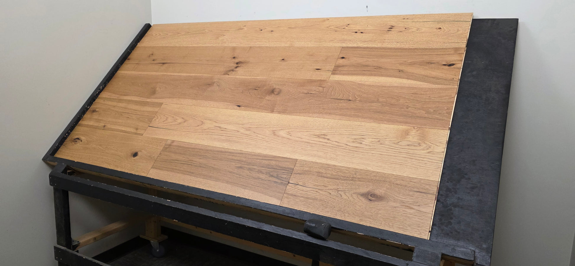 9 1/2" x 5/8" Engineered Hickory Collins Hardwood Flooring on a black shooting table wide shot right angle 