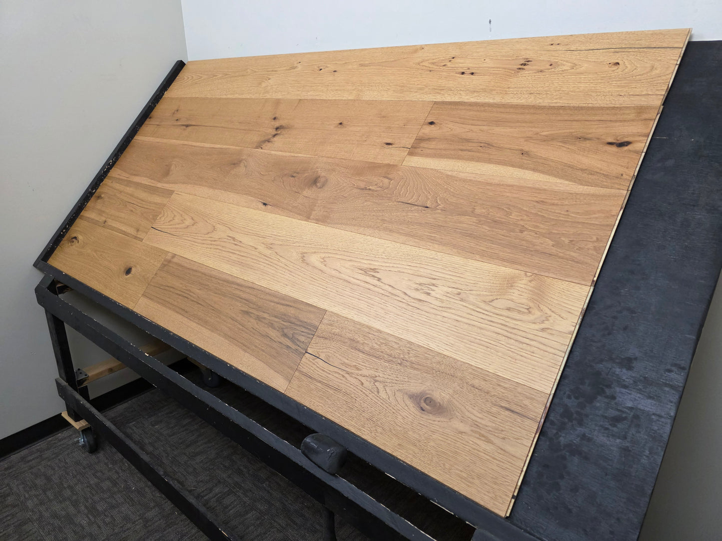 9 1/2" x 5/8" Engineered Hickory Collins Hardwood Flooring on a black shooting table wide shot right angle 