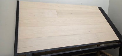 9 1/2" x 5/8" Engineered Red Oak Initium Hardwood Flooring on a black shooting table. Left side shot
