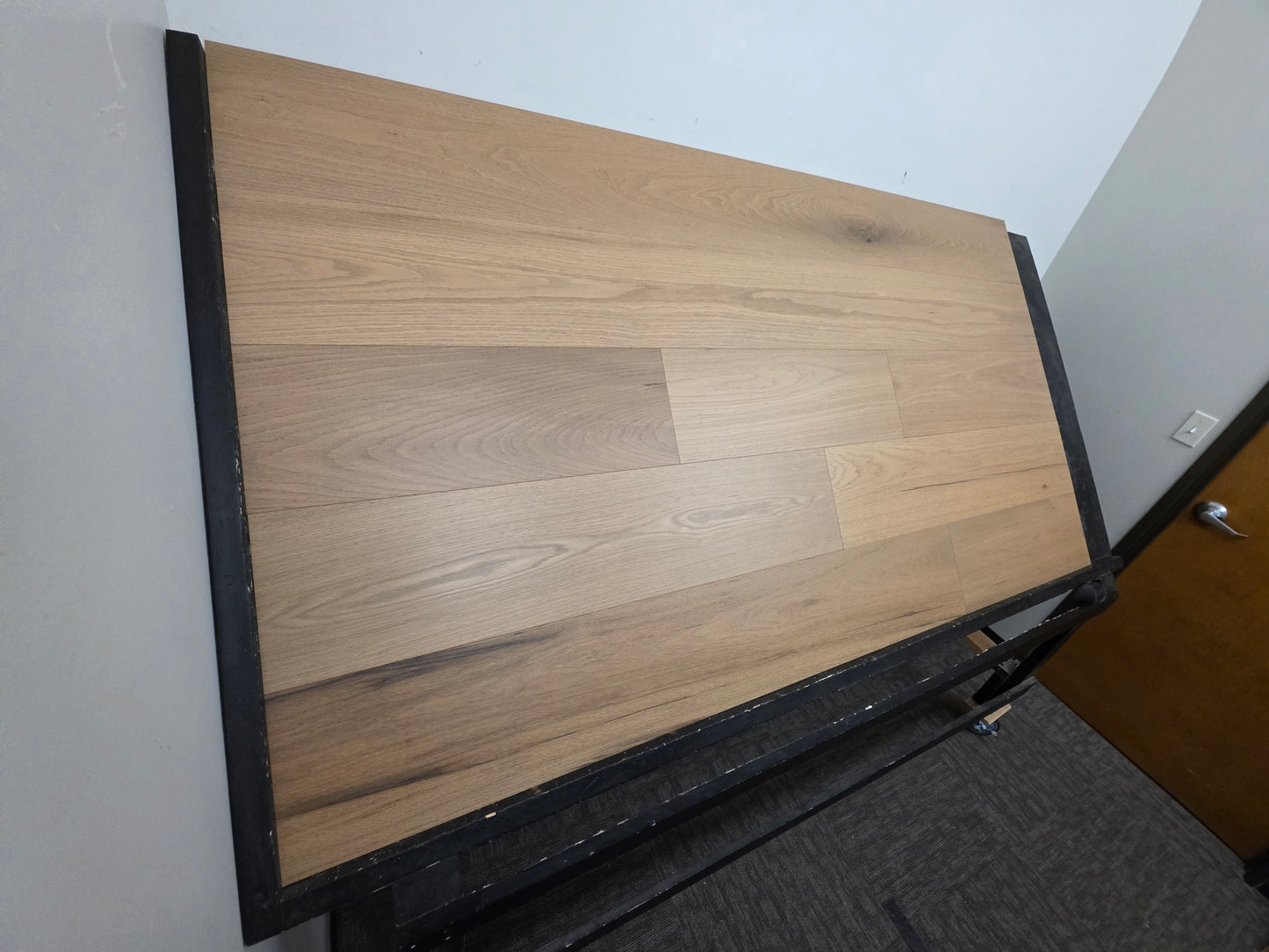 9 12 x 58 Engineered Red Oak Phoebe Hardwood Flooring wide angle shot. On a black shooting table.
