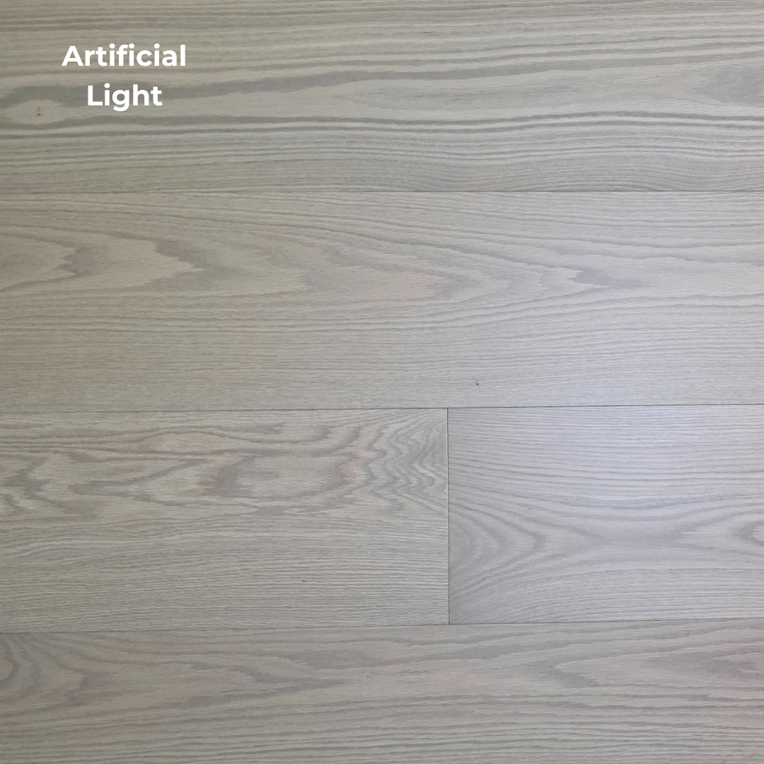 9 1/2" x 5/8" Engineered White Oak Finch Hardwood Flooring. Shown in artificial lighting. 