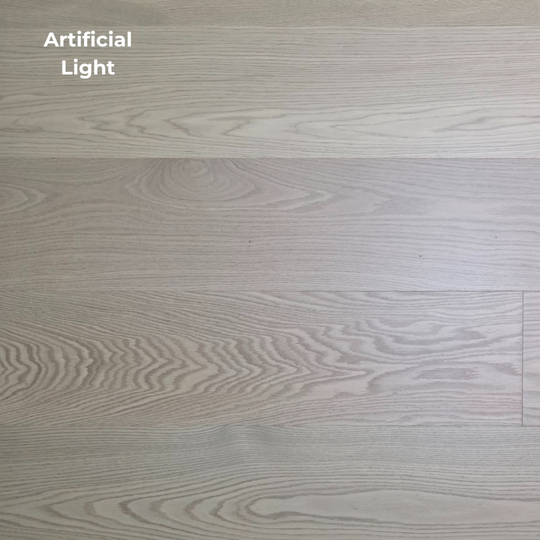 9 1/2" x 5/8" Engineered White Oak Swan Hardwood Flooring. Shown in artificial lighting.