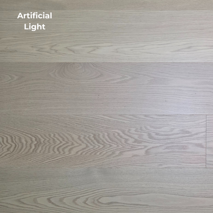 9 1/2" x 5/8" Engineered White Oak Swan Hardwood Flooring. Shown in artificial lighting.