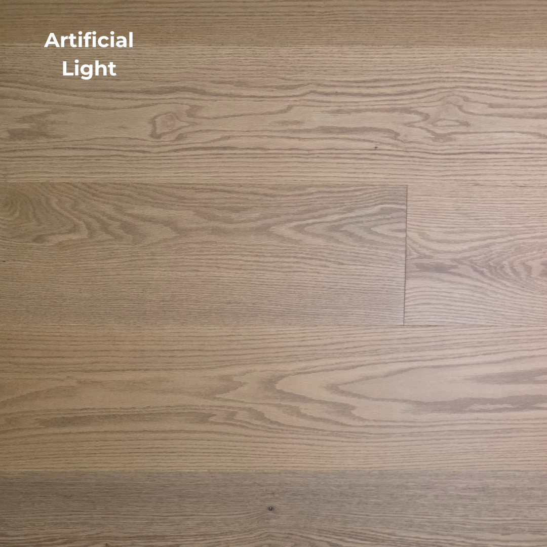 9 1/2" x 5/8" Engineered White Oak Waxwing Hardwood Flooring shown in artificial lighting.